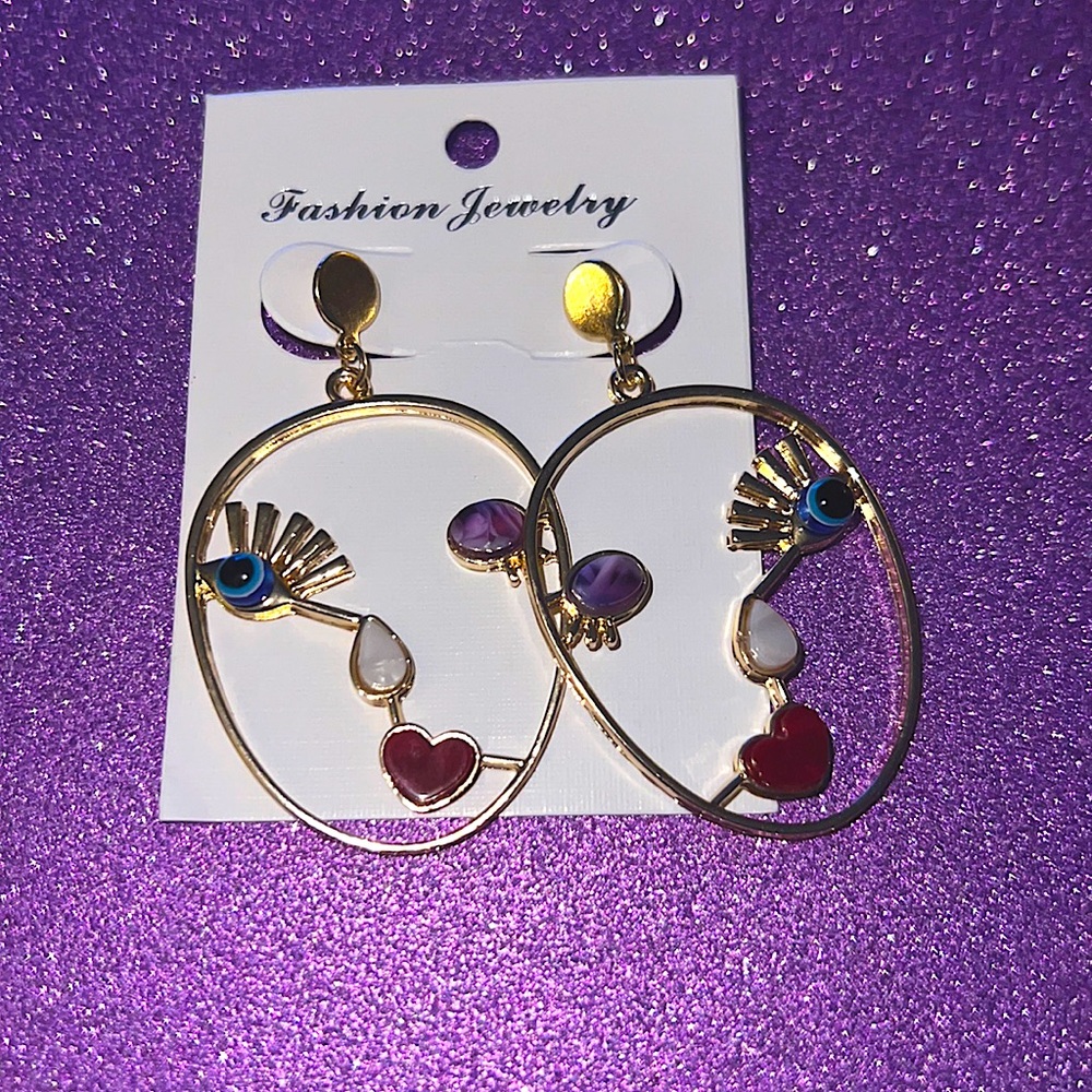 Face silhouette statement earrings